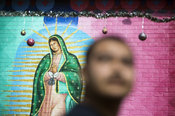 This mural of the Virgin Mary inside Ramona Gardens was just repainted this past summer. Many residents in the public housing development are Catholic. Every year on December 12 at 5 a.m., there's a celebration here with mariachi music.