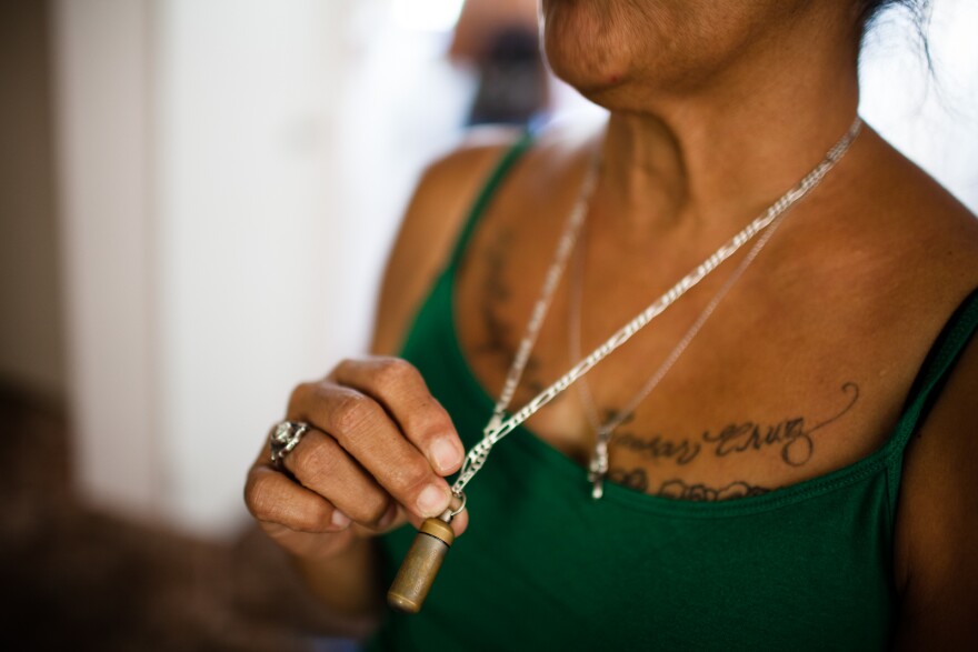 Smith carries some of the ashes of her son, Caesar Cruz, around her neck. Cruz was shot and killed by Anaheim police in 2009.