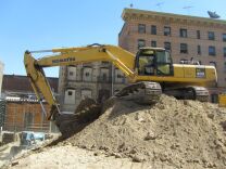 Jack Murray operates three heavy machines on the New Genesis Apartments construction site.  Building the permanent supportive housing facility is expected to generate about 200 jobs. Officials say hundreds more will come online when it opens in December, 2010.
