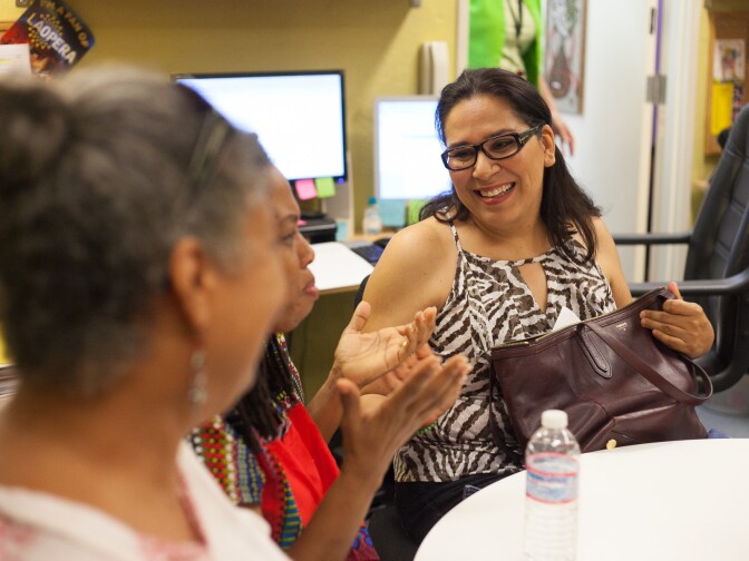 Gloria Lopez Enriquez (right) speaks with fellow parents about what their kids are getting out of attending opera camp in Los Angeles, Calif. on Wednesday Aug. 5, 2015. She and her 17-year old son, Ernesto, come from San Diego to participate in the two-week intensive camp. 