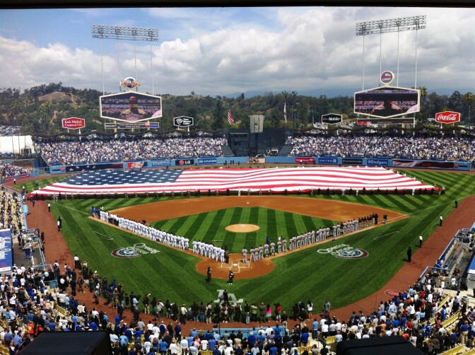 The Stars and Stripes came out as fans sang the National Anthem at Opening Day at Dodger Stadium.