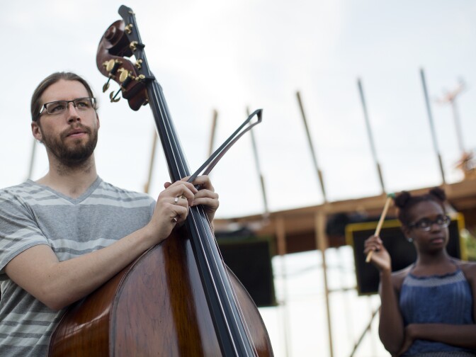 Bassist Scott Worthington takes part in a rehearsal of the final scene of "Hopscotch" at the Central Hub in the Arts District on Friday, Oct. 23, 2015.