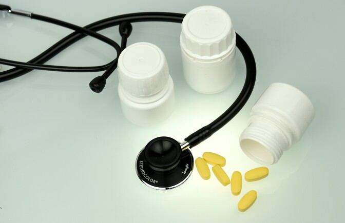 A picture taken on March 14, 2016 shows tablets and a stethoscope displayed for an illustration on a desktop in Paris.  
French Finance Minister Michel Sapin said on March 15, 2016 that the Social Security deficit for 2015 is expected be "lower than expected". According to French newspaper Les Echos, the deficit of the health insurance scheme was lowered last year to seven billion euros, two billion euros less than the anticipated nine billion. / AFP / FRANCK FIFE        (Photo credit should read FRANCK FIFE/AFP/Getty Images)