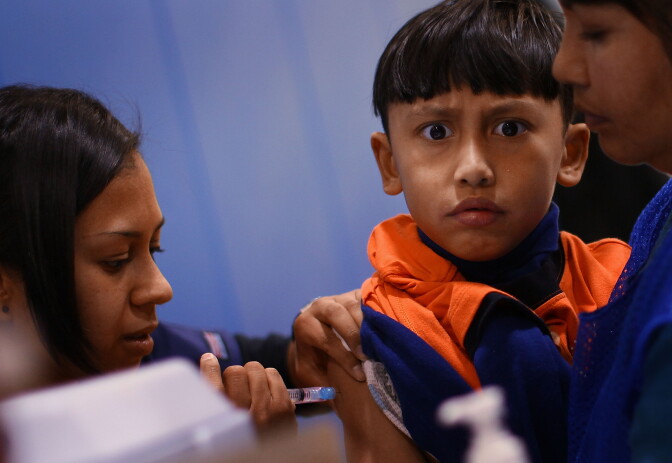 In this file photo, a student receives a vaccination at Carlin Springs Elementary School January 7, 2010 in Arlington, Virginia. California public health officials say the anti-vaccination movement could spark a resurgence of measles, since the unvaccinated are more susceptible to contracting it.