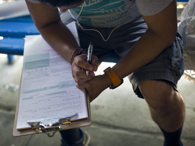 A student at North Hollywood High School fills out a voter registration form during lunch on Thursday, April 30, 2015 as part of a student voter drive.