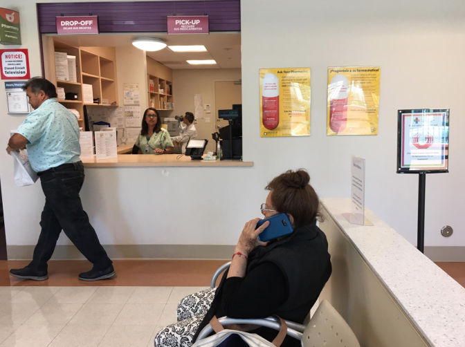 A patient picks up a prescription at the QueensCare Health Center in East Los Angeles. 