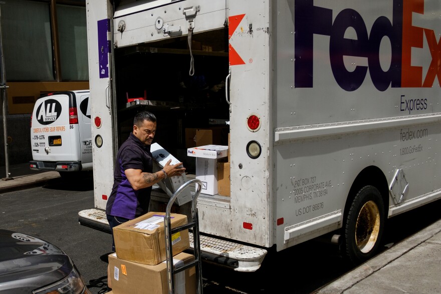 NEW YORK, NY - JUNE 2: A FedEx delivery driver unloads packages from his truck in Lower Manhattan,  June 2, 2017 in New York City. While U.S. unemployment has hit it lowest level since 2001 at 4.3 percent for May, the U.S. economy added only 138,000 jobs last month and many Americans have stopped looking for work. (Photo by Drew Angerer/Getty Images)
