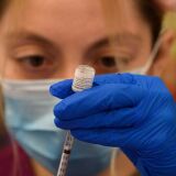 A health care worker prepares a dose of the Pfizer Covid-19 vaccine after it was approved for use by the FDA in children 12 and over at a Los Angeles County mobile vaccination clinic on May 14, 2021 in Los Angeles, California. (Photo by Patrick T. FALLON / AFP) (Photo by PATRICK T. FALLON/AFP via Getty Images)