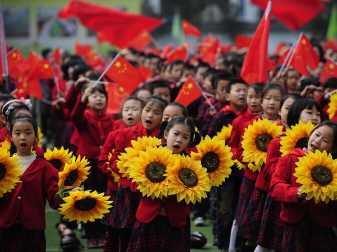 Chinese children celebrate the Communist Party in Chongqing municipality in March. Bo Xilai, the region's party secretary who is vying for a place in the Politburo Standing Committee, espouses a government-intervention model to economics.