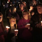 Denizens of Roseburg gather at a candlelight vigil for the victims of a shooting October 1, 2015 in Roseburg, Oregon. According to reports, 10 were killed and 20 injured when a gunman opened fire at Umpqua Community College in Roseburg, Oregon.
