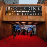 HOLLYWOOD, CA - DECEMBER 10:  People walk near an entrance to the red carpet before the premiere of Walt Disney Pictures and Lucasfilm's "Rogue One: A Star Wars Story" at the Pantages Theatre on December 10, 2016 in Hollywood, California.  (Photo by Ethan Miller/Getty Images)