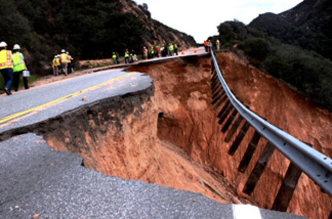 Caltrans and state emergency officials inspect a damaged section of Highway 330 near Highland on Thursday, Jan. 6, 2011. It could take up to two years to repair the storm-damaged roadway. 
