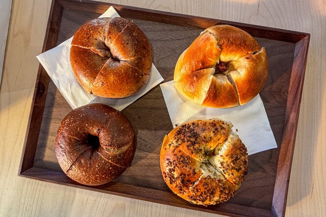 Four Taiwanese-style bagels arranged on a wooden tray at Miopane in Pasadena.