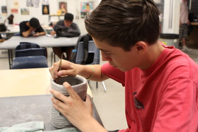 Tenth grader Isaiah Piazza at Rowland High School works on a coil pot. The school recently brought back ceramics classes and about 60 students are now learning to work with clay. 