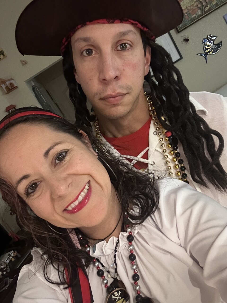 A man and woman are dressed in pirate costumes