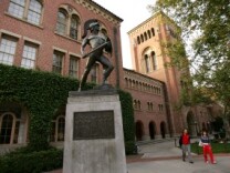 Students walk across the campus of the University of Southern California.