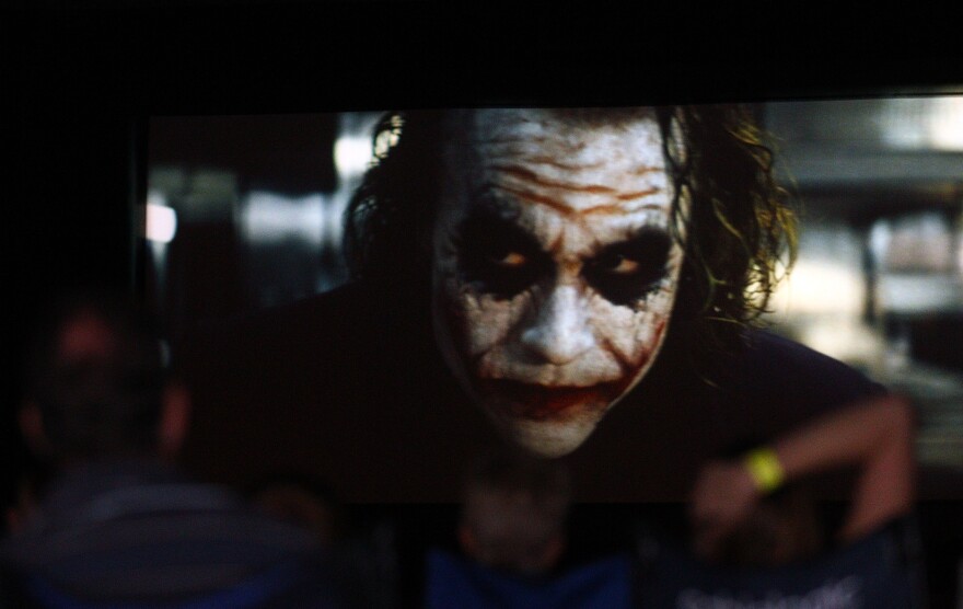 PERTH, AUSTRALIA - FEBRUARY 12:  Film goers watch The Dark Knight featuring Heath Ledger during a public tribute outdoor movie night to the late actor at Burswood Park on February 12, 2011 in Perth, Australia. Australian actor Heath Ledger won a posthumous Oscar for his portrayal of the Joker in the movie The Dark Knight. Ledger died from an accidental toxic combination of prescription drugs on January 22, 2008. (Photo by Paul Kane/Getty Images) *** Local Caption *** Heath Ledger