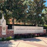 A sign in stone that says University of Southern California