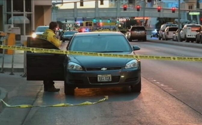 Police investigate the scene of a shooting between cars on the Las Vegas Strip early Thursday, Feb. 21, 2013 in Las Vegas. Gunshots fired from a black Range Rover on the Strip early Thursday caused a Maserati to crash into a taxi, creating a fireball and killing three people as the SUV sped away. It's the latest in a series of violent actions on the tourist corridor since the beginning of the year.
