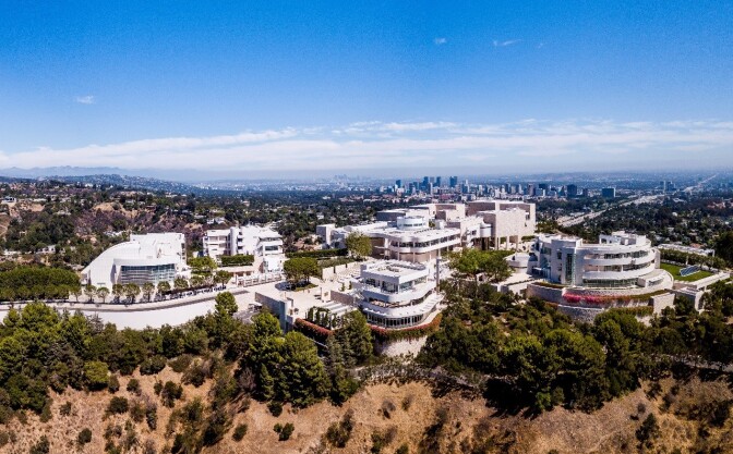 An aerial view of the Getty Center sitting on a mountaintop during the daytime. 