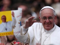 Pope Francis greets the faithful prior to his first 'Urbi et Orbi' blessing from the balcony of St. Peter's Basilica during Easter Mass on March 31, 2013 in Vatican City, Vatican. 