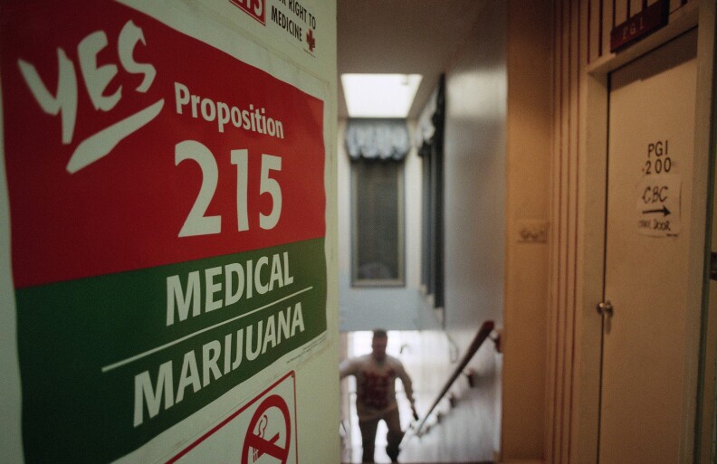 A staff member of the Cannabis Buyers Club walks up the stairs to the club in the Hollywood section of Los Angeles on election eve on Tuesday, Nov. 5, 1995 in Los Angeles. One of the propositions voters in California will decide on is whether to legalize marijuana for medical purposes. The Cannabis Buyers Club sells marijuana to patients who can prove, with a doctors prescription, that they need the product for certain medical reasons. 