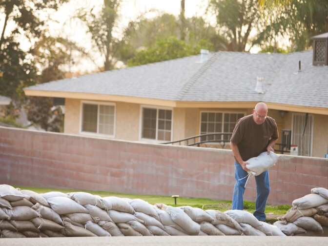 Glendora resident Greg Williams, prepares for an upcoming storm onThursday, Dec. 11, 2014.

(Photos by Susanica Tam/ for KPCC)