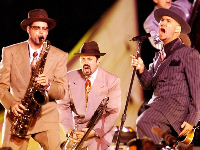 Swing band Big Bad Voodoo Daddy performs during the halftime show at Super Bowl XXXIII on January 31 at Pro Player Stadium in Miami, Florida.
