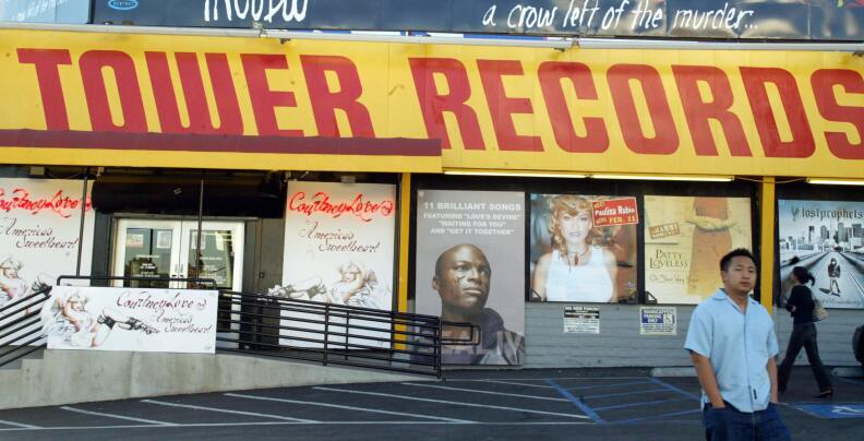 A patron leaves the Tower Records store in West Hollywood, California, February 6, 2004.
