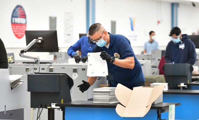 Ballots are counted at the Los Angeles County Regional Offices in Downey, California on November 3, 2020, after the polls closed for the 2020 US Elections. - President Donald Trump and Democratic challenger Joe Biden are battling it out for the White House, with polls closed across the United States Tuesday -- and a long night of waiting for results in key battlegrounds on the cards. (Photo by Frederic J. BROWN / AFP) (Photo by FREDERIC J. BROWN/AFP via Getty Images)