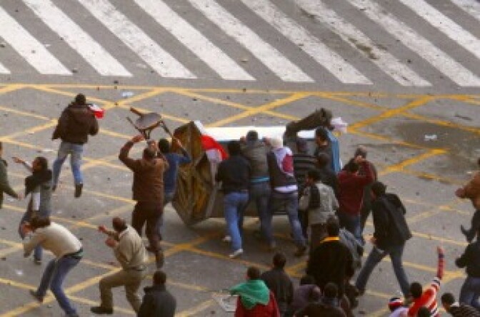 Egyptian demonstrators clash with Egyptian police in central Cairo during a protest to demand the ouster of President Hosni Mubarak. 