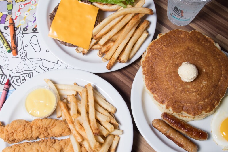 Kids menu items from Norms include chicken tenders and fries, pancakes and sausage and a cheeseburgers and fries.