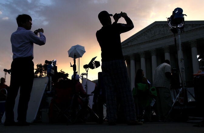 People start to gather in front of the U.S. Supreme Court on June 28, 2012 in Washington, D.C.
