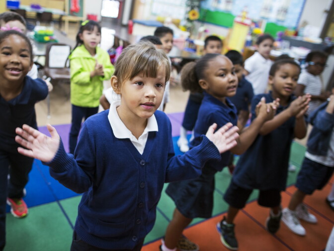 Kindergarteners Kameera Turrentine, left, Daisy Mayer-Glenn, center, and Lena Winston sing a song with their class at Willard Elementary School in Pasadena, two weeks into the school year, on Wednesday morning, Aug. 31, 2016.