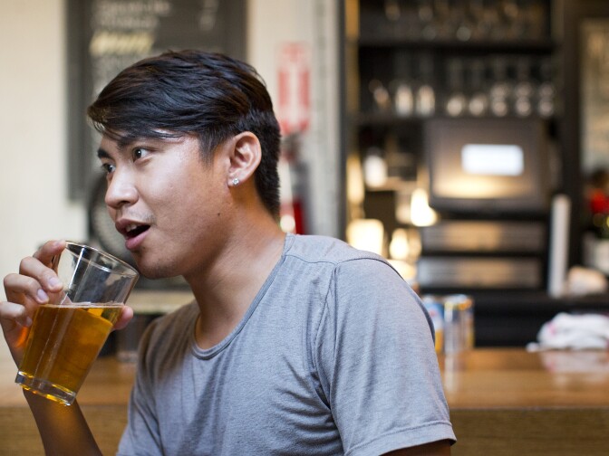 Justin Fabillar spends time with friends at Little Joy in Silver Lake on Tuesday, July 29. Fabillar has tried both Tinder and OkCupid.