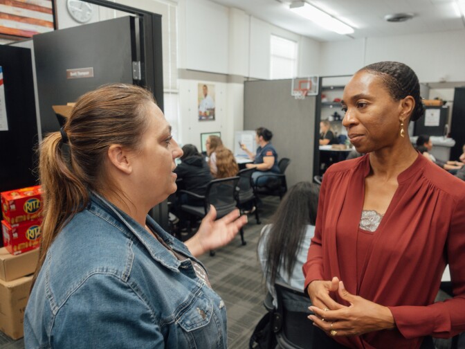 Dr. Miatta Snetter (right) speaks to Marine Corps veteran Sherry Pope at the Fullerton College Veterans Resource Center.