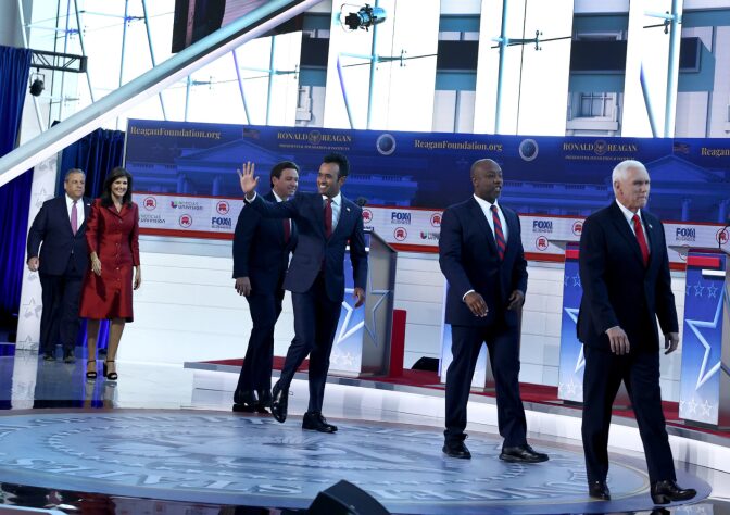Republican presidential candidates walk on stage during the FOX Business Republican Primary Debate at the Ronald Reagan Presidential Library in Simi Valley, California.