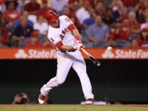 Mike Trout #27 of the Los Angeles Angels of Anaheim hits a base hit against the Seattle Mariners in the third inning at Angel Stadium of Anaheim on Sept. 25, 2012 in Anaheim.
