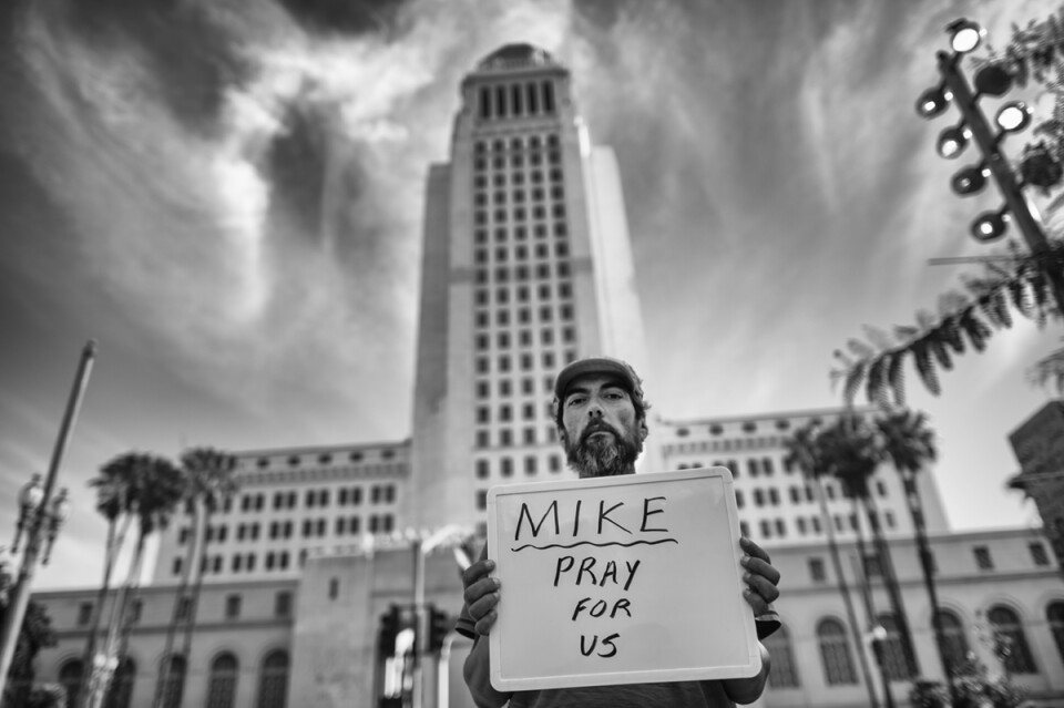 LA City Hall
Mike Ortiz, 51-years old, born in Boyle Heights, homeless since 9-2-12, "my spirt is a little broken, the pilot light is on but the flame is not very high” Mike stays in an area near the Walt Disney Concert Hall with friends that look out for one another. 

Sign: Mike: “Pray for us”
 (Photo by Hans Gutknecht/Los Angeles Daily News)