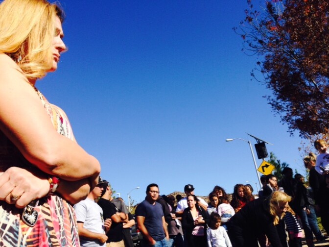 Fans of actor Paul Walker and friends of Roger Rodas gathered Sunday at the scene of the crash that took their lives the previous afternoon.