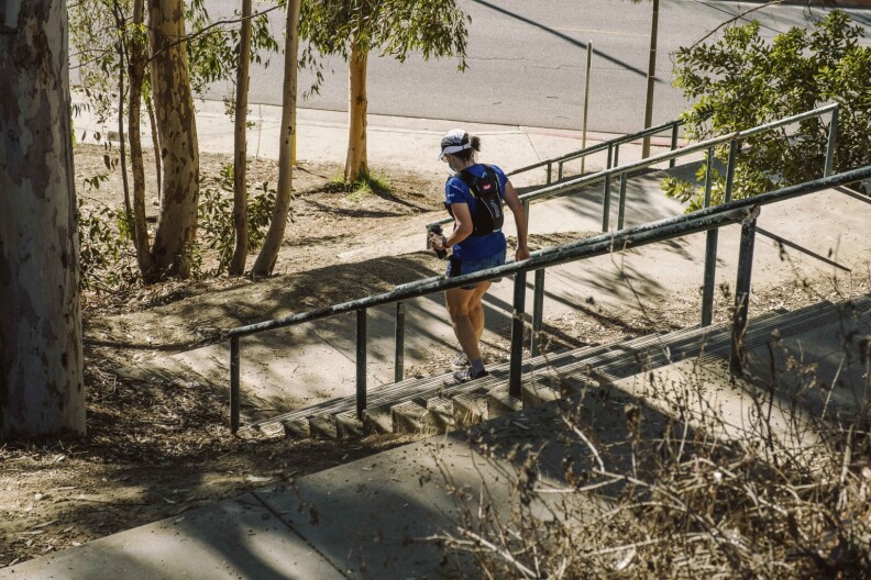 Reporter Sharon McNary descends a staircase at Culver City Park.