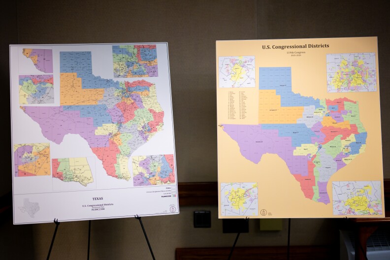 Two large posters with maps of Texas are shown side by side. Each map is broken down into several differently colored districts.