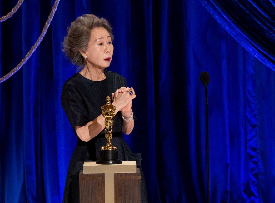 Korean actress Yuh-Jung Youn accepts her Oscar trophy at the 2021 Academy Awards.