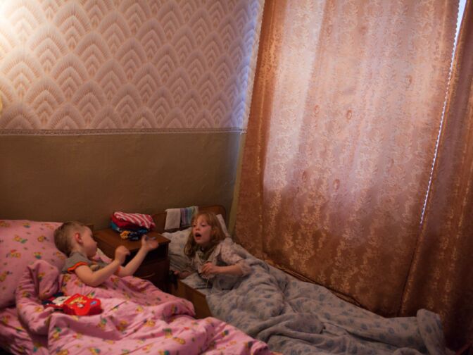 Oxana and another boy play before going to bed. Teachers at the orphanage say that Oxana sometimes exhibits sexual behavior due to her history of sexual abuse.