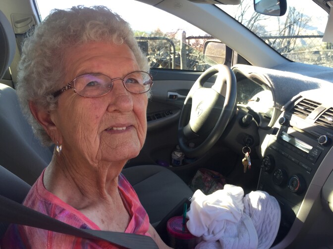 Charlene Vehlewald sits in a car outside of her daughter's home that burned to the ground in the South Lake community northeast of Bakersfield. It was one of more than 250 homes destroyed by the Erskine Fire. 