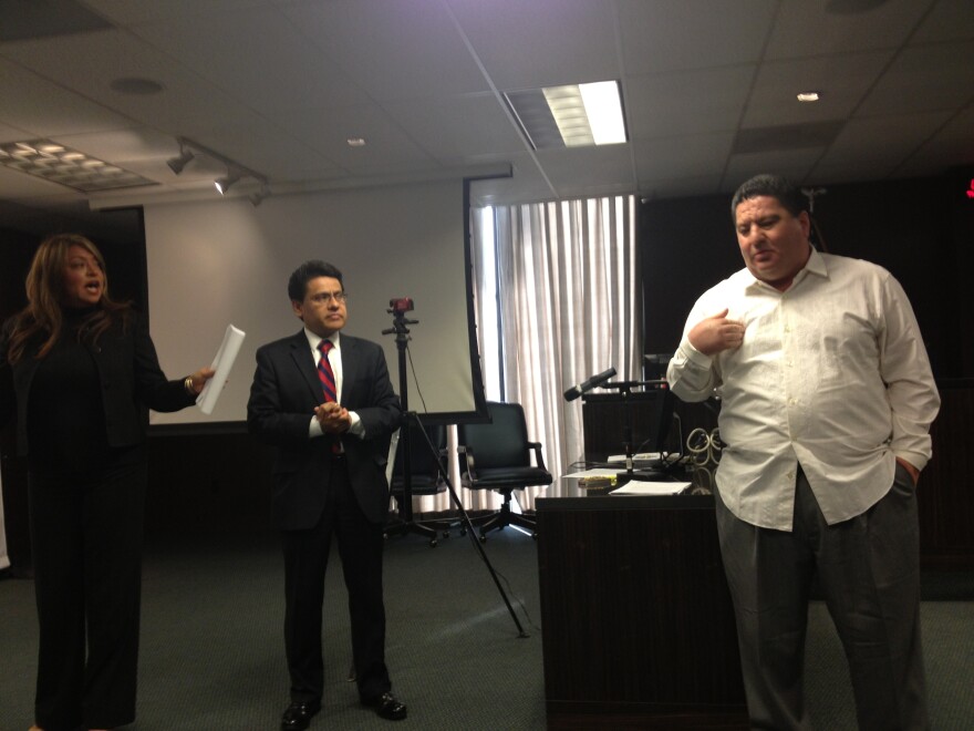 Central Basin board member Art Chacon (right) trades accusations of corruption with board member Leticia Vasquez (left) at a March 13th news conference, as Bell city councilman Nestor Valencia (center) looks on.