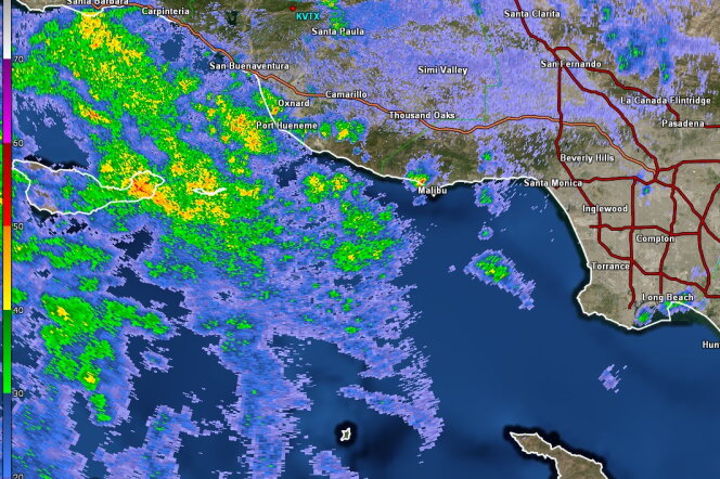 A graphic of the Southern California coast shows pockets of heavy rainfall