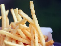 BRISTOL, ENGLAND - JANUARY 07:  French fries from a fast food outlet is seen on January 7, 2013 in Bristol, England.  A government-backed TV advert - made by Aardman, the creators of Wallace and Gromit - to promote healthy eating in England, is to be shown for the first time later today. England has one of the highest rates of obesity in Europe - costing the NHS 5 billion GDP each year - with currently over 60 percent of adults and a third of 10 and 11 year olds thought to be overweight or obese.  (Photo by Matt Cardy/Getty Images)
