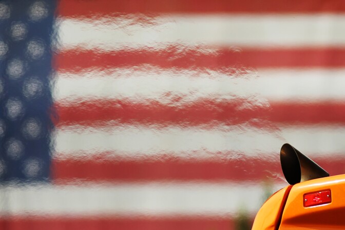 LOS ANGELES, CA - APRIL 25:  Heat waves emanate from the exhaust pipe of a city transit bus as it passes an American flag hung on the Los Angeles County Hall of Justice by workers renovating the historic structure on April 25, 2013 in Los Angeles, California. The nation's second largest city, Los Angeles, has again been ranked the worst in the nation for ozone pollution and fourth for particulates by the American Lung Association in it's annual air quality report card. Ozone is a component of smog that forms when sunlight reacts with hydrocarbon and nitrous oxide emissions. Particulates pollution includes substances like dust and soot.   (Photo by David McNew/Getty Images)