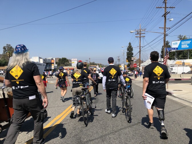 As the advocates walked down Foothill Boulevard, they encouraged parade-watchers to put down their phones while driving, and to slow down. 
